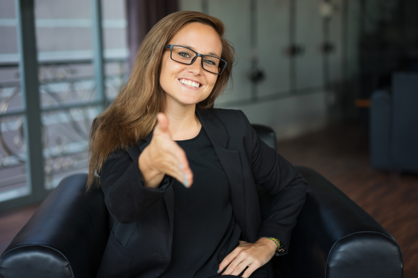 Happy Business Lady Extending Arm for Handshake